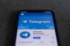 a cell phone with the telegram app on it