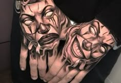 a person with tattoos on their hands and two faces