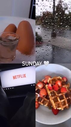 a plate with waffles, strawberries and eggs next to a glass of water