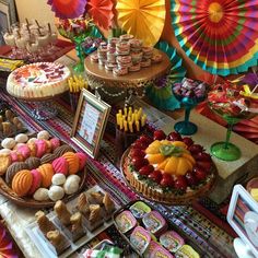 an assortment of desserts and pastries displayed on a table