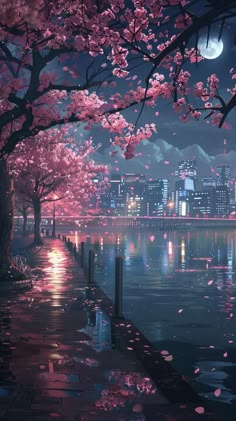 the city is lit up at night with cherry blossoms on the trees and reflecting in the water