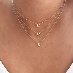 This stainless steel alphabet necklace is the perfect gift for any fashion-forward woman. The letters are available in gold or silver, adding a touch of elegance to any outfit. Made from high-quality stainless steel, this necklace is also water-resistant, ensuring a long-lasting fit. Its versatile design allows it to be worn alone or layered with other necklaces for a fashionable look. Deliver style with this stunning stainless steel women's alphabet necklace -Delivered with pouch. .Necklace len Stainless Steel Initials Name Necklace, Tan Monogram Initial Pendant Necklace, Tan Initial Pendant Necklace, Dainty White Gold Initial Pendant Necklace, Dainty White Gold Necklace With Initial Pendant, Trendy Initial Pendant Charm Necklaces, Trendy Initial Pendant Charm Necklace For Mother's Day, Trendy Initial Pendant Necklace For Mother's Day, Elegant Initial Pendant Necklace With Letter Beads