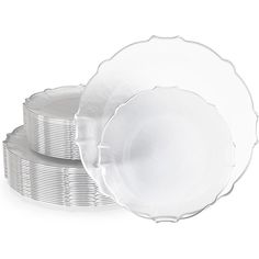 stack of white plates stacked on top of each other in front of a white background