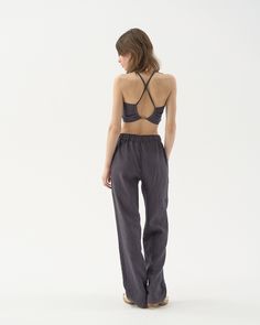 "These straight-cut linen pants are the perfect blend between relaxed and fitted. Comfy enough to be beach wear, yet simultaneously just right for an evening out. Offered in medium-weight and exclusive linen. STYLE DETAILS * Relaxed fit * Straight cut * Mid to low rise * Elasticated waist * 2 pockets in side seams * Full length * Made from medium-weight and exclusive linen SIZES & COLORS IN THE PICTURES * Model 1 is wearing size S in Mysterious Grey (medium) linen. Model's height - 174 cm (5'8\" Stretch Linen Wide Leg Bottoms, Linen Wide Leg Pants With Elastic Waistband, Stretch Linen Wide Leg Pants, Stretch Linen High-waisted Pants, Stretch Linen Wide-leg Pants, Stretch Linen Pants For Loungewear, Stretch Linen Pants With Elastic Waistband, Stretch Linen Wide Leg Pants With Elastic Waistband, Fitted Linen Pants With Elastic Waistband