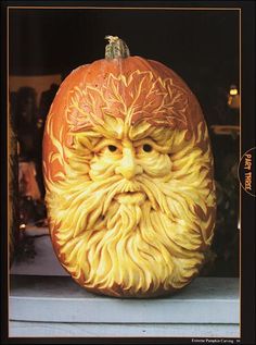 a carved pumpkin with an image of santa claus on it's face and beard