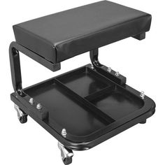 a black stool with two trays on it