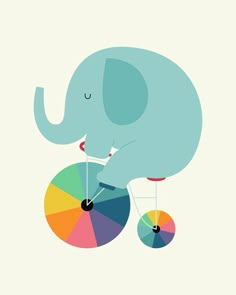 an elephant is riding on a bicycle with a colorful wheel around it's spokes