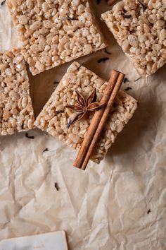 homemade granola bars with cinnamon stick and star anise on parchment paper, top view