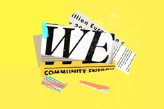 several pieces of newspaper laying on top of each other in front of a yellow background