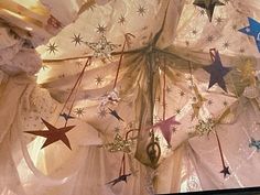 the ceiling is decorated with stars and ribbons