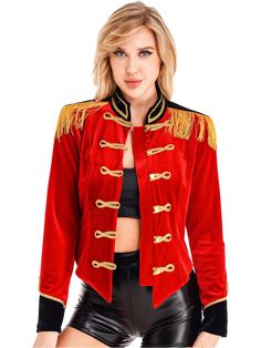 a woman wearing a red jacket with gold trimmings and black leather shorts is posing for the camera