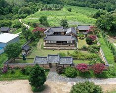 an aerial view of a house surrounded by trees