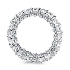 a white gold ring with rows of diamonds on the inside and outside, set in 18k white gold