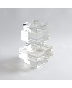 three stacked clear boxes sitting on top of each other