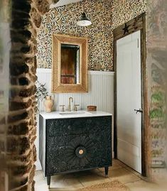 a bathroom with a sink and mirror in it