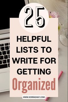 a laptop computer sitting on top of a desk next to a pink pen and paper