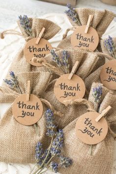 small bags filled with lavender flowers and thank you tags