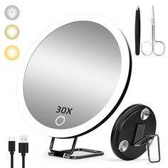 an image of a round mirror with scissors and other items around it on a white background