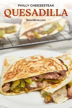 a quesadilla on a plate with meat and vegetables in the background text reads philly cheesesteak quesadilla