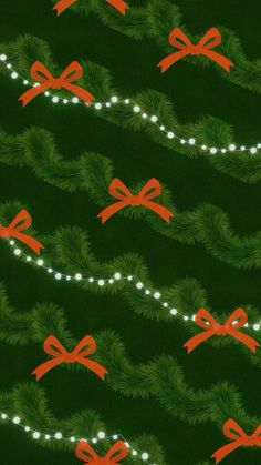 a green background with red bows and lights