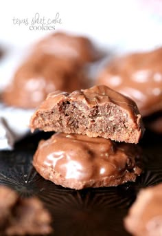 chocolate covered cookies are stacked on top of each other with one bite taken out of it