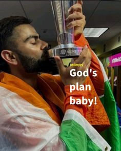 a man holding up a trophy with the words god's plan baby