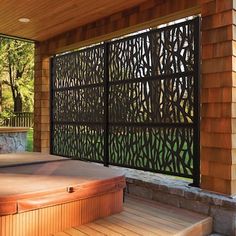 a hot tub sitting under a wooden structure