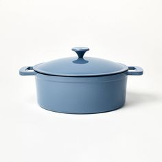 a blue casserole dish on a white background