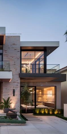 an exterior view of a modern home at dusk