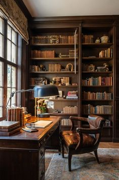 an office with lots of books on the shelves and a chair in front of it