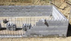 the construction site is being built with concrete blocks