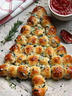 a cheesy christmas tree bread on a cutting board