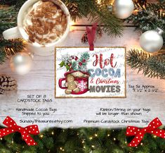 an advertisement for hot cocoa and christmas movies on a wooden table with pine cones, firs and ornaments