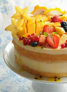 there is a cake with fruit on it