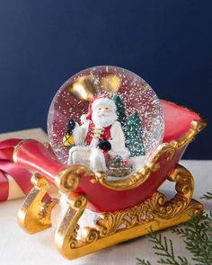 a snow globe sitting on top of a sleigh