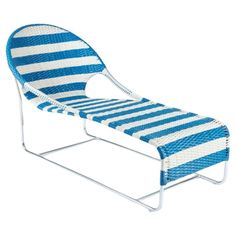 a blue and white striped chaise lounge chair with metal frame on an isolated white background