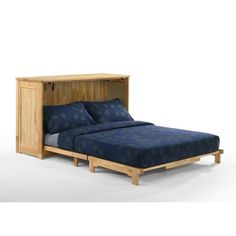 a bed with a blue bedspread and wooden headboard next to a night stand