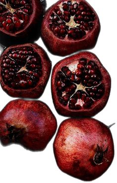 the pomegranates are cut in half and ready to be used as garnishes