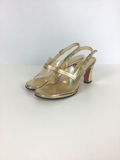 "Highly recommend getting a good pedicure for these sassy vintage 1960s gold lame leather peep toe high heels Made of gold lame leather clear plastic toebox that is highlighted with a gold strap.  Gold instep The heel of the shoe is also covered in gold-colored leather Adjustable slingback strap for a secure fit, gold toned metal buckle  Soles of the shoes are made of leather Open-toe peep-toe style Measurements: Marked size 5M US 5 US/ 34.5 EU/ 21 Asia Insole: 8 5/8\" Ball: 2.75\"  Heel height: 60s Shoes, Sling Back Shoes, Back Shoes, Gold Lame, Shoes Vintage, Peep Toe Shoes, Knitted Coat, 60s Fashion, Colored Leather