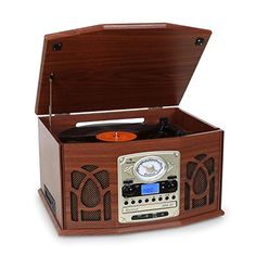 an old - fashioned record player is shown with the radio in it's wooden case