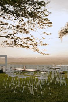 tables and chairs are set up in the grass