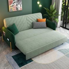 a living room with a green couch and rug