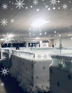 an office building with snowflakes hanging from the ceiling