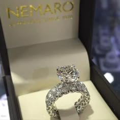 a diamond ring in a box with the name nemaro on it's side