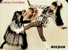 two women dressed in costume posing for a magazine advertisment's photo