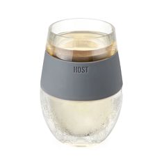 the stemless wine glass has a grey band around it's bottom and is filled with liquid