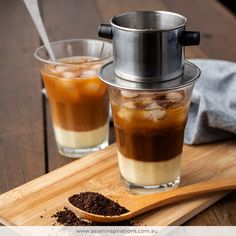 two glasses of iced coffee on a cutting board