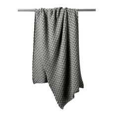 a gray and white towel hanging on a clothes line