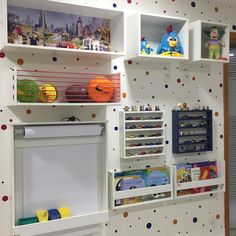 the children's playroom is decorated with polka dot wallpaper