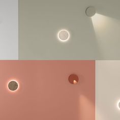 three different colored walls with round lights on each side and circular light above the wall